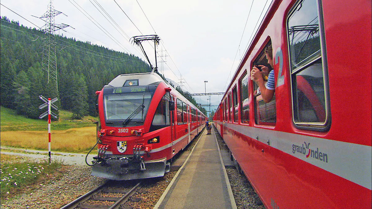 Glacier Express trains pass